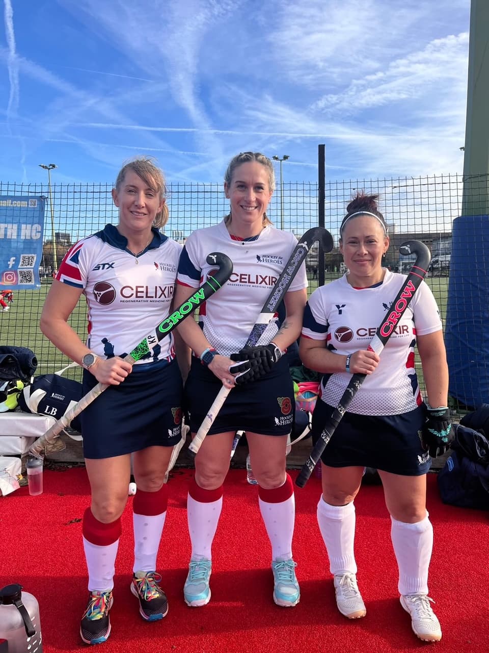 Crow Hockey athletes holding sticks